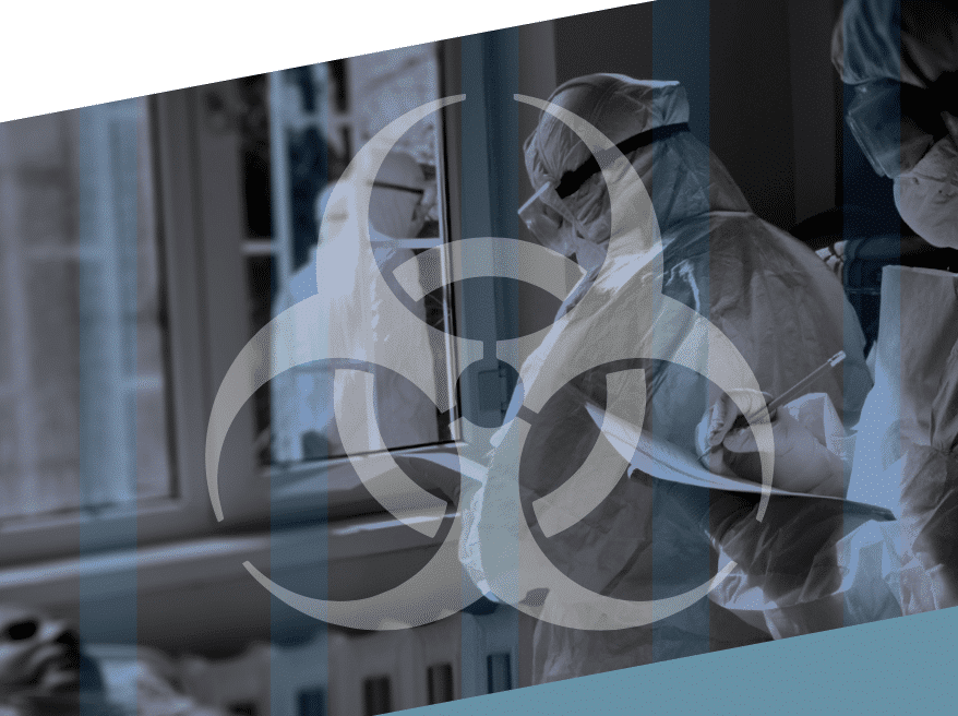 men in white quarantine suits and a hazard sign